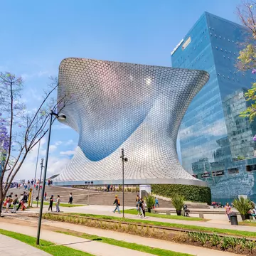 Exterior view of the Museo Soumaya on a sunny day in Mexico City.