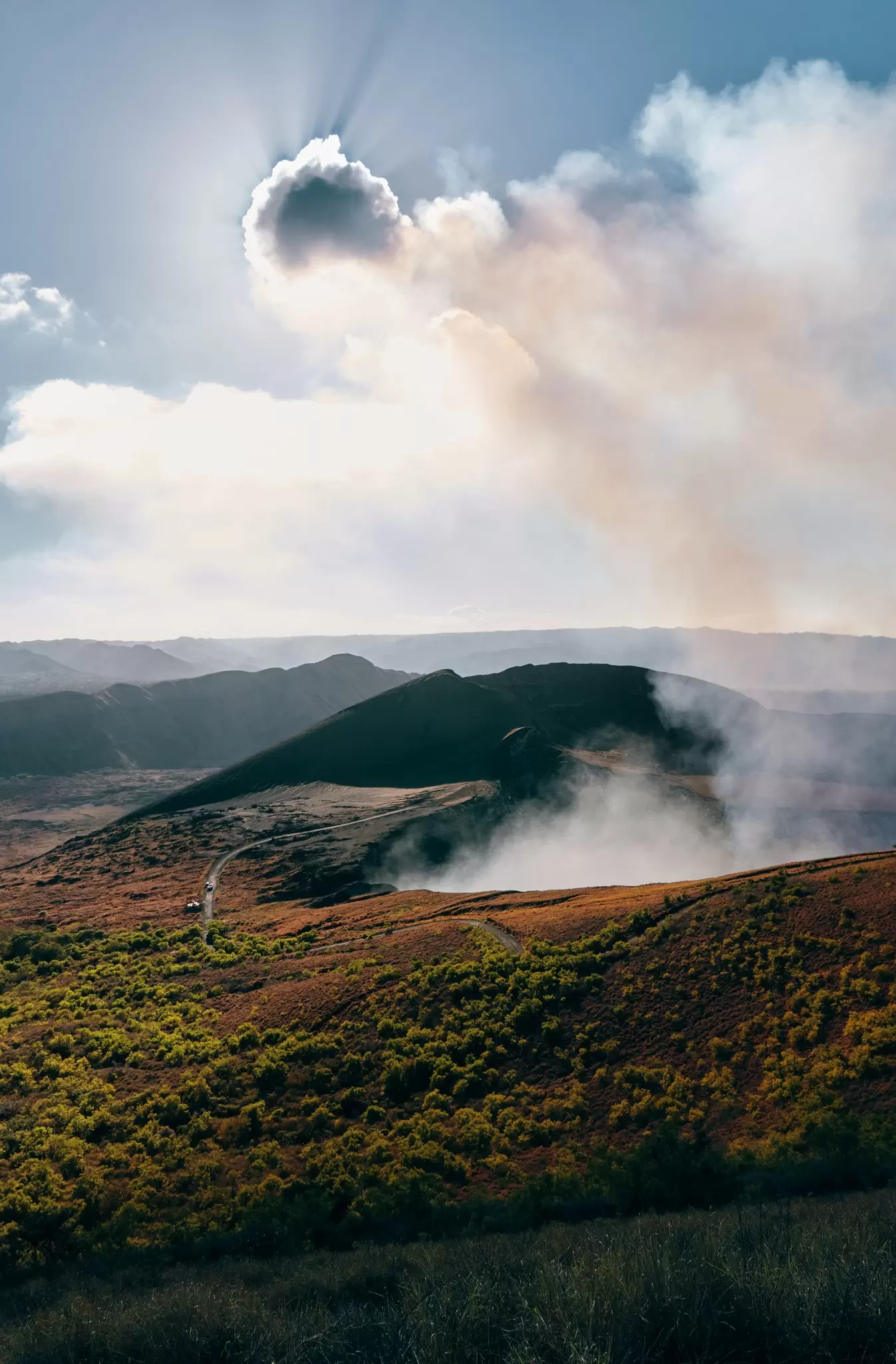 Steam rising out of an active volcano.