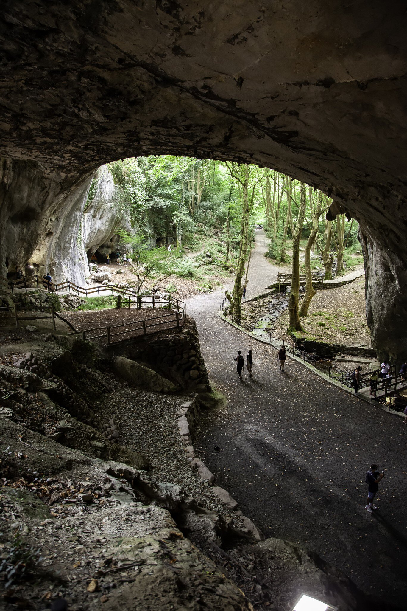 Visitors walking inside the Cuevas de Zugarramurdi in Spain.