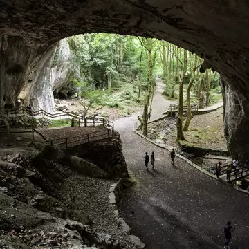 Visitors walking inside the Cuevas de Zugarramurdi in Spain.