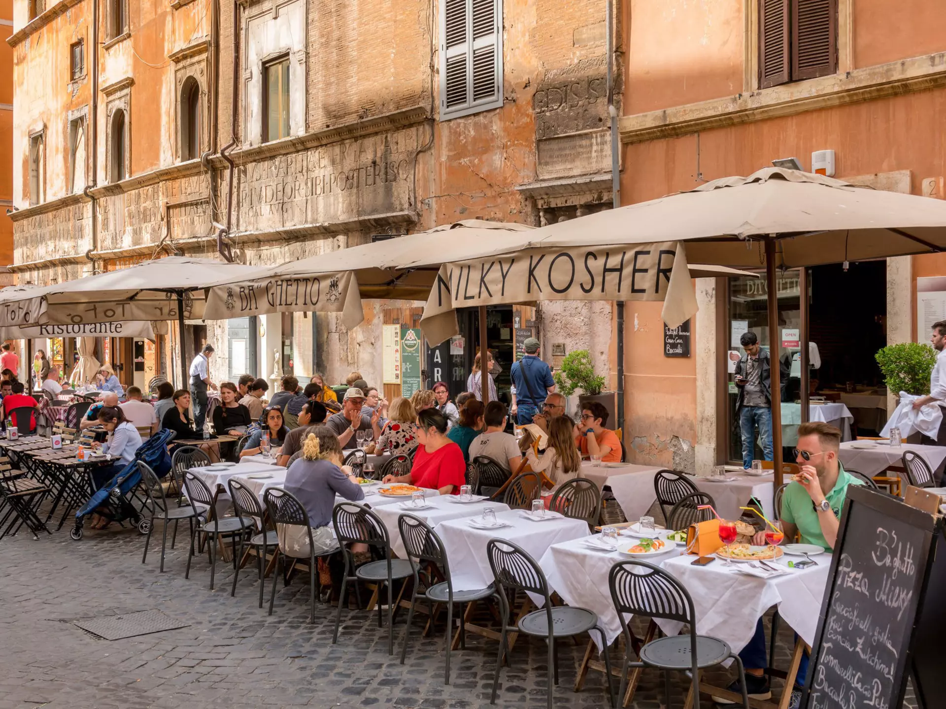 Diners outside a restaurant in the Jewish Ghetto quarter of Rome