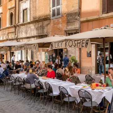 Diners outside a restaurant in the Jewish Ghetto quarter of Rome