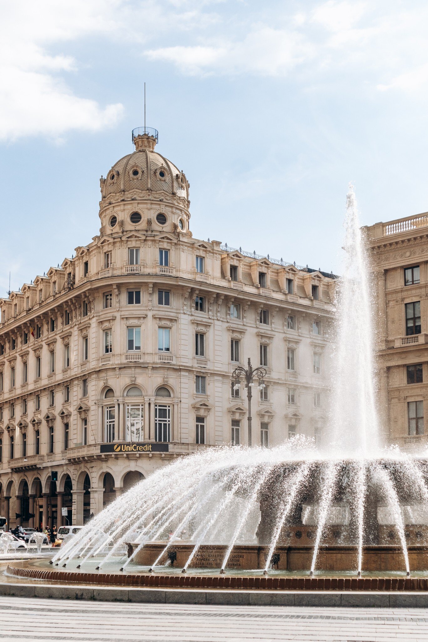 View of Piazza De Ferrari, the main square of Genoa, featuring the iconic bronze fountain designed by Giuseppe Crosa di Vergagni in 1936.