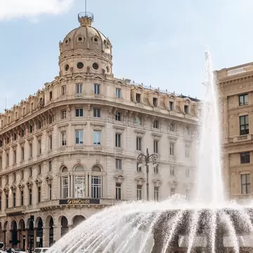 View of Piazza De Ferrari, the main square of Genoa, featuring the iconic bronze fountain designed by Giuseppe Crosa di Vergagni in 1936.