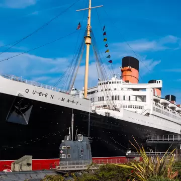 The Queen Mary ocean liner, now a museum and major tourist attraction docked in Long Beach, California, with the Russian submarine  'Scorpion' in front.