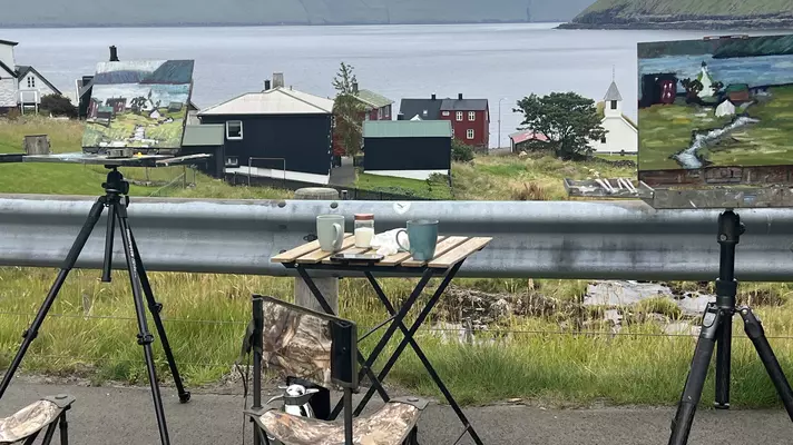 Two paintings with the village in the background and the ocean