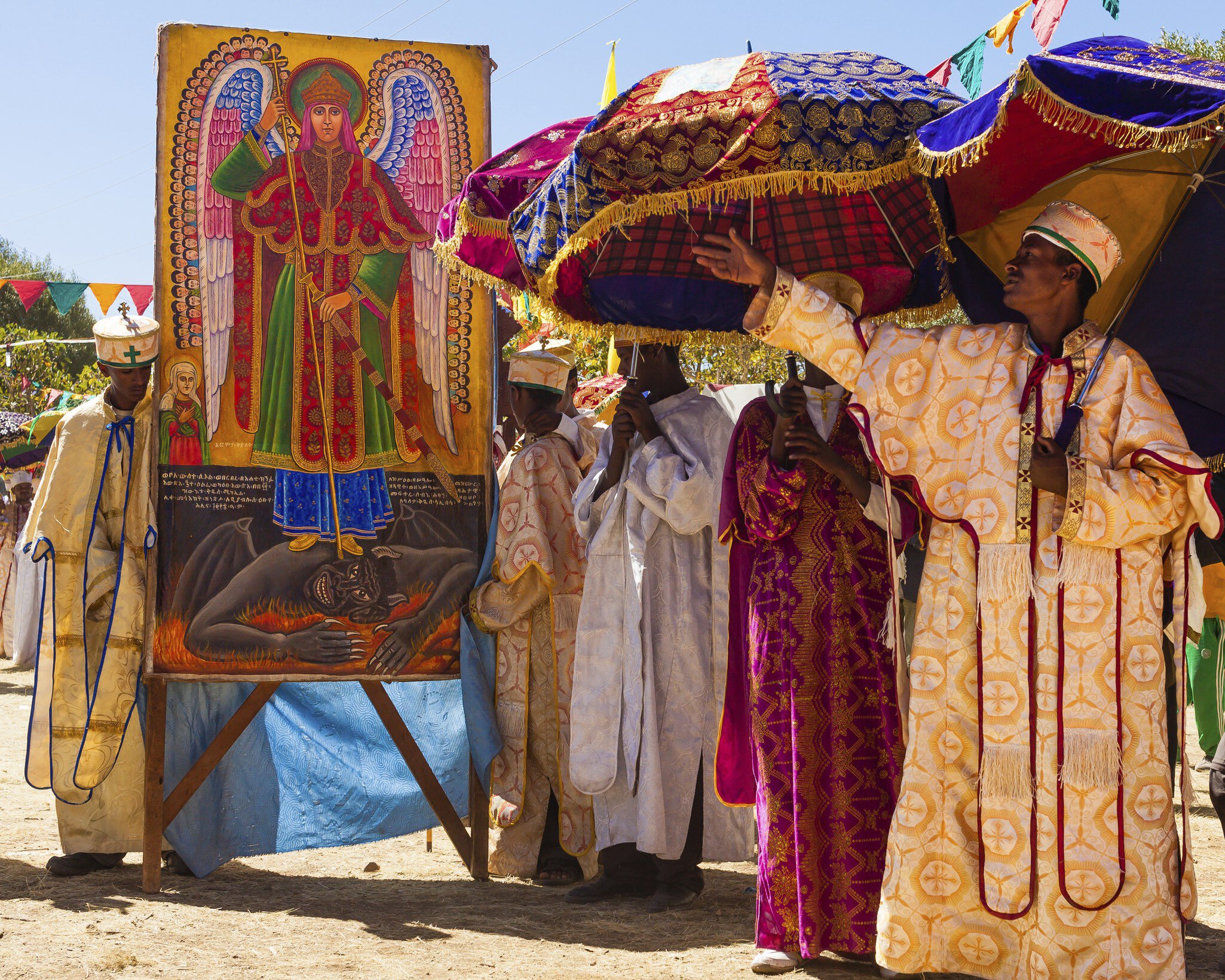 Africa, Devil, Ethiopia, Ethiopian, Lalibela, Mary, Satan, Timkat, Virgin, african, amharic, ark, black, boy, boys, celebration, christianity, clothe, colored, covenant, east africa, epiphany, festival, festivity, hat, hats, historical, holiday, holy, human, jesus, looking, man, orthodox, orthodox church, painting, people, person, pilgrim, pilgrims, prayer, praying, priest, priests, procession, relic, religion, religious, religious festival, silk, skoufos, skufia, skufiya, sunny, tabot, teenager, textile, the Virgin Mary, timket, timqat, tradition, traditional, traditions, tunic, umbrella, vertical, warm, wrap
CLEARED FOR DIGITAL USE ONLY -