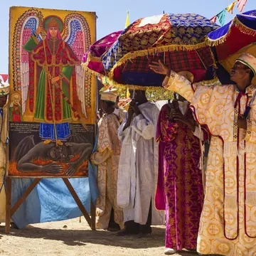 Africa, Devil, Ethiopia, Ethiopian, Lalibela, Mary, Satan, Timkat, Virgin, african, amharic, ark, black, boy, boys, celebration, christianity, clothe, colored, covenant, east africa, epiphany, festival, festivity, hat, hats, historical, holiday, holy, human, jesus, looking, man, orthodox, orthodox church, painting, people, person, pilgrim, pilgrims, prayer, praying, priest, priests, procession, relic, religion, religious, religious festival, silk, skoufos, skufia, skufiya, sunny, tabot, teenager, textile, the Virgin Mary, timket, timqat, tradition, traditional, traditions, tunic, umbrella, vertical, warm, wrap
CLEARED FOR DIGITAL USE ONLY -