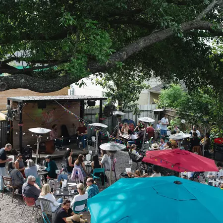 People enjoy live music in Bacchanal's backyard.