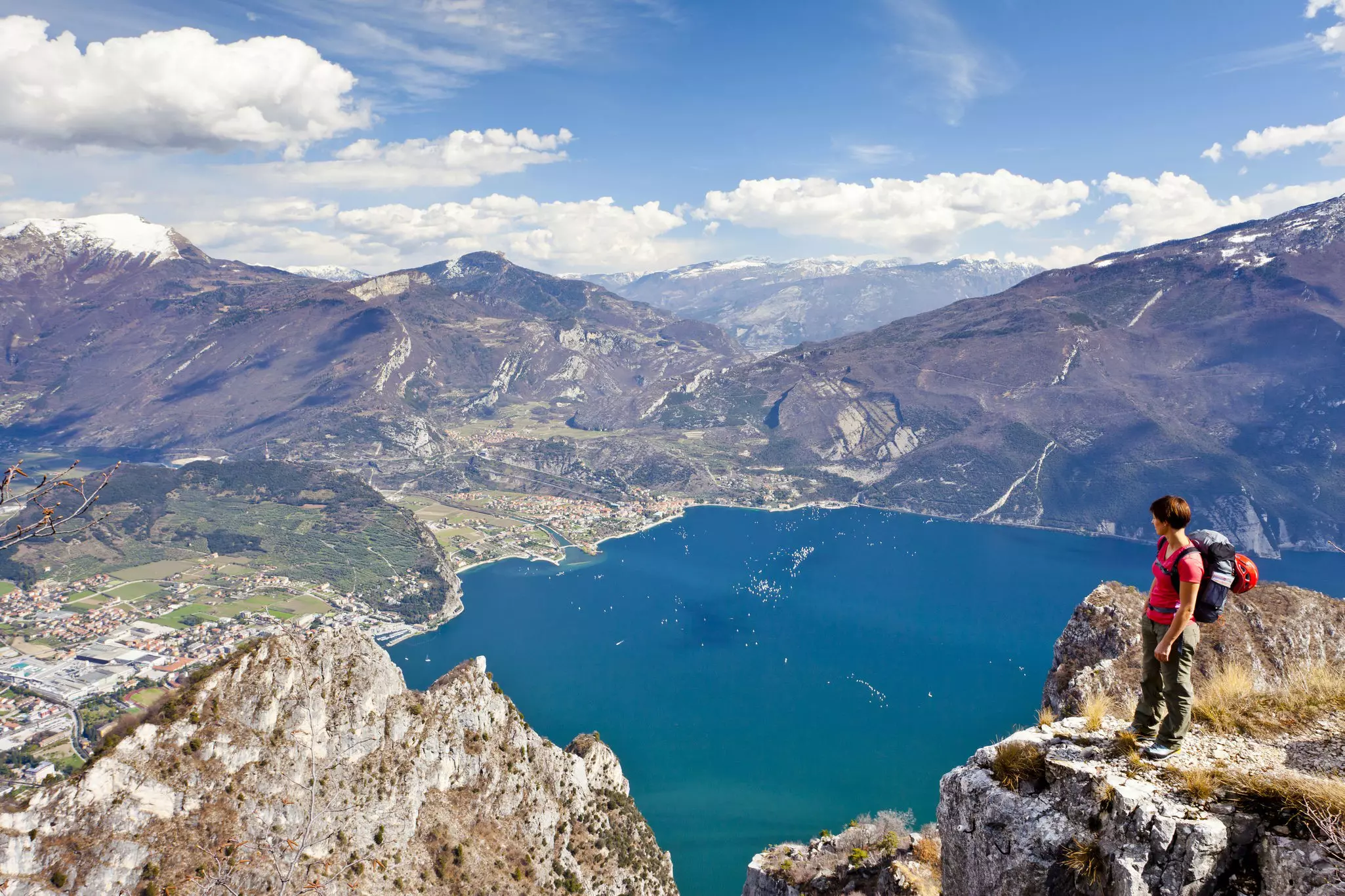 Climber on the Cima Rocca, via ferrata with view of Lake Garda, Riva and Nago-Torbole, Trentino, Italy, Europe
