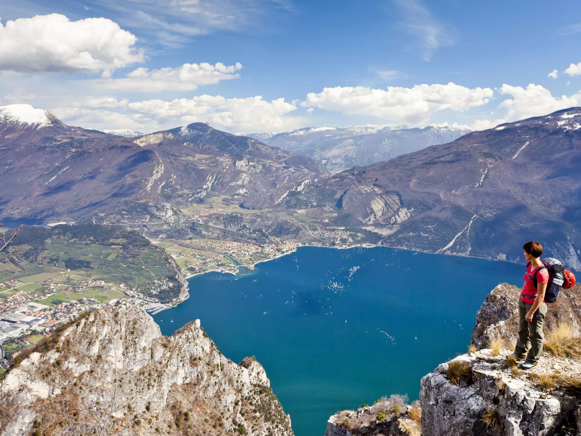 Climber on the Cima Rocca, via ferrata with view of Lake Garda, Riva and Nago-Torbole, Trentino, Italy, Europe