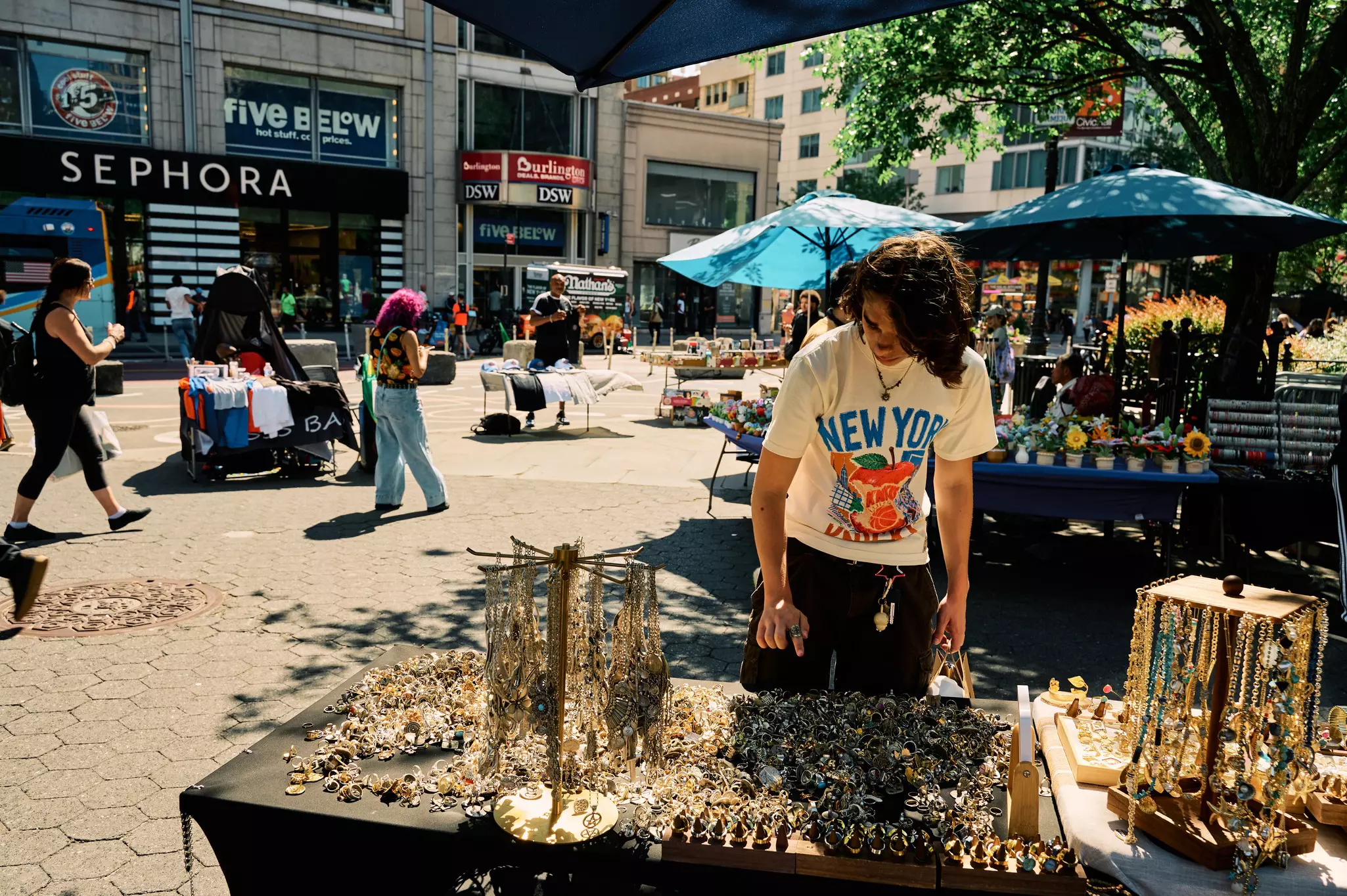 A stall holder selling jewelry in Union Square, NYC