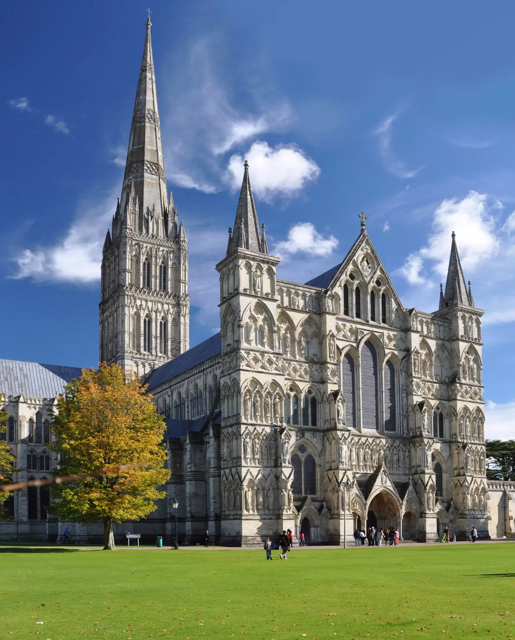 The exterior of a huge Gothic-style cathedral building with an exceptionally tall spire