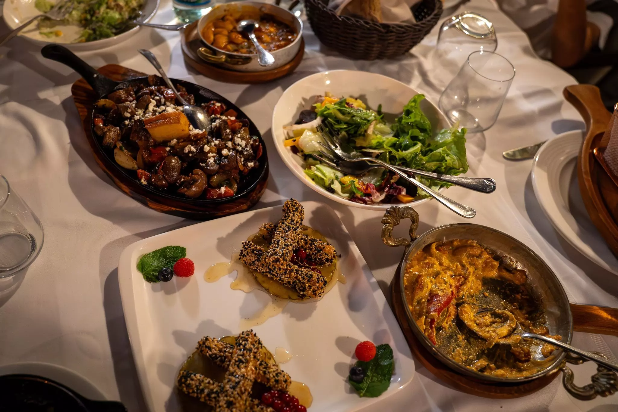 Table spread with traditional Albanian dishes in Tirana restaurant