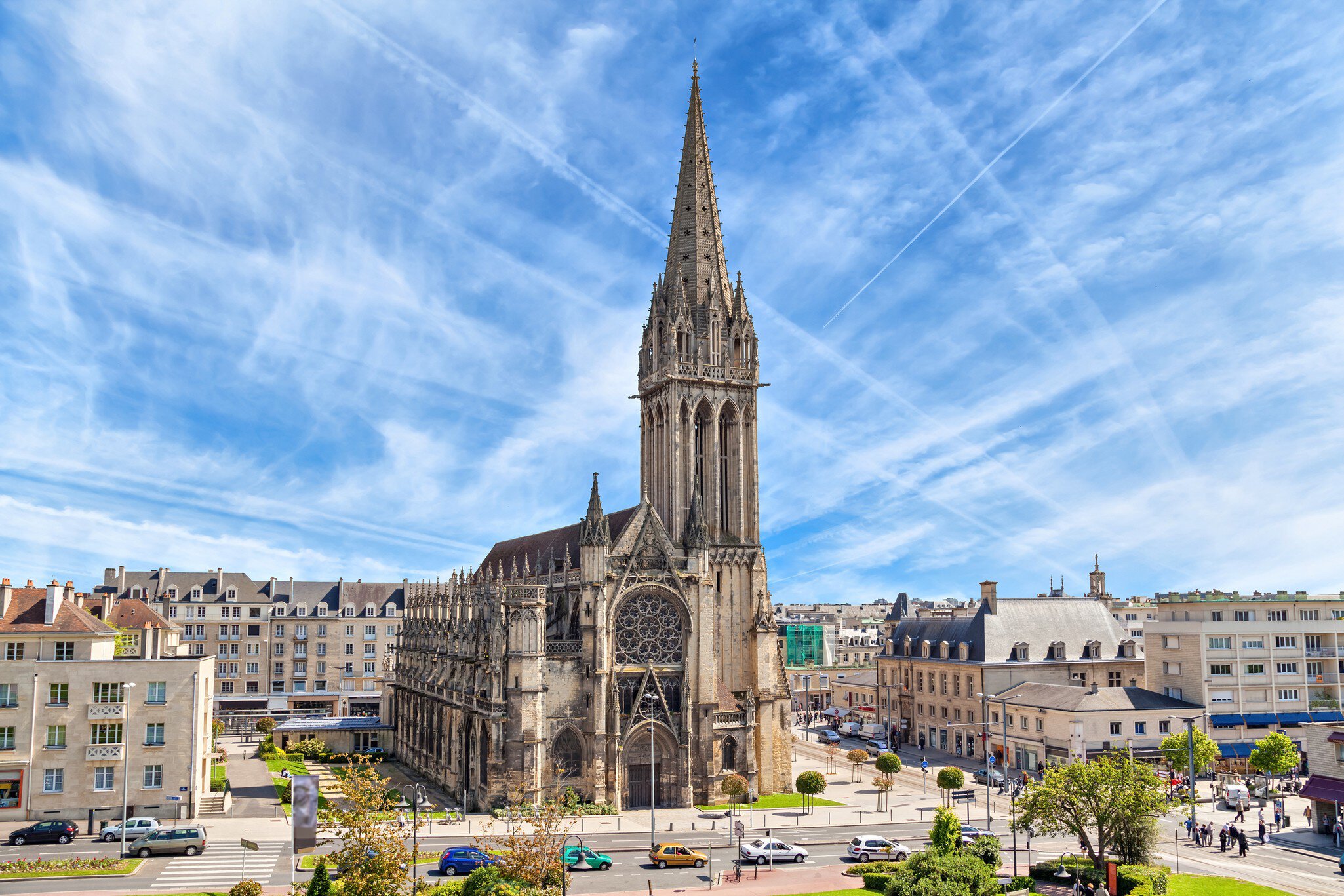 Church of Saint-Pierre in Caen, with streaks of white cloud in the sky.