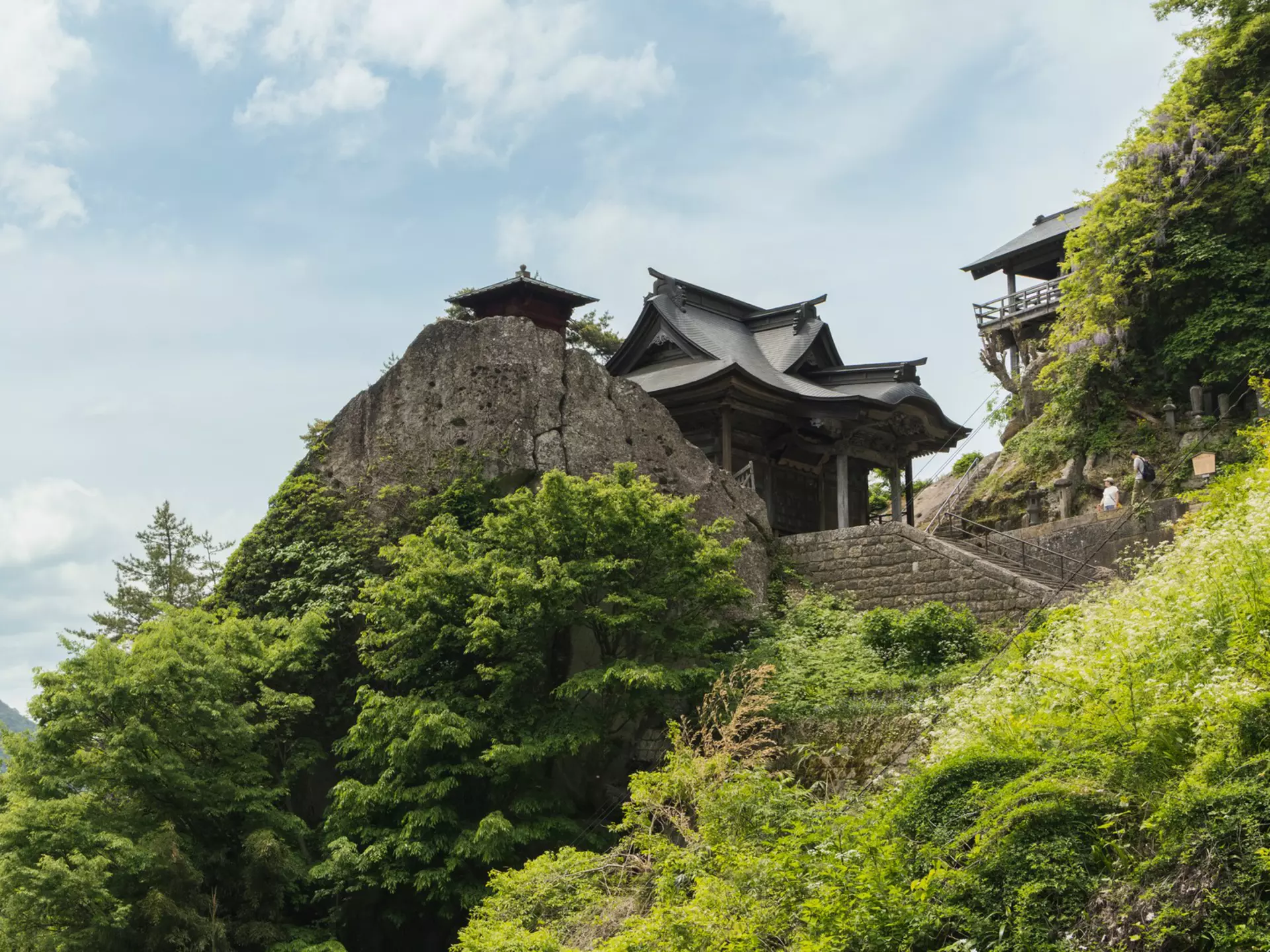 A hilltop temple surrounded by greenery