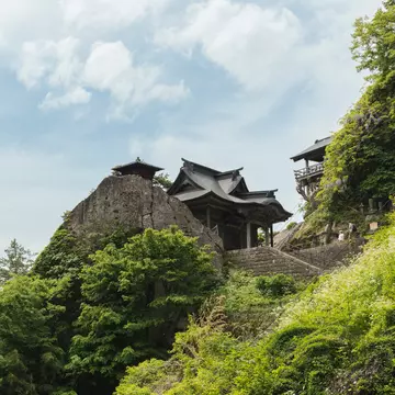 A hilltop temple surrounded by greenery