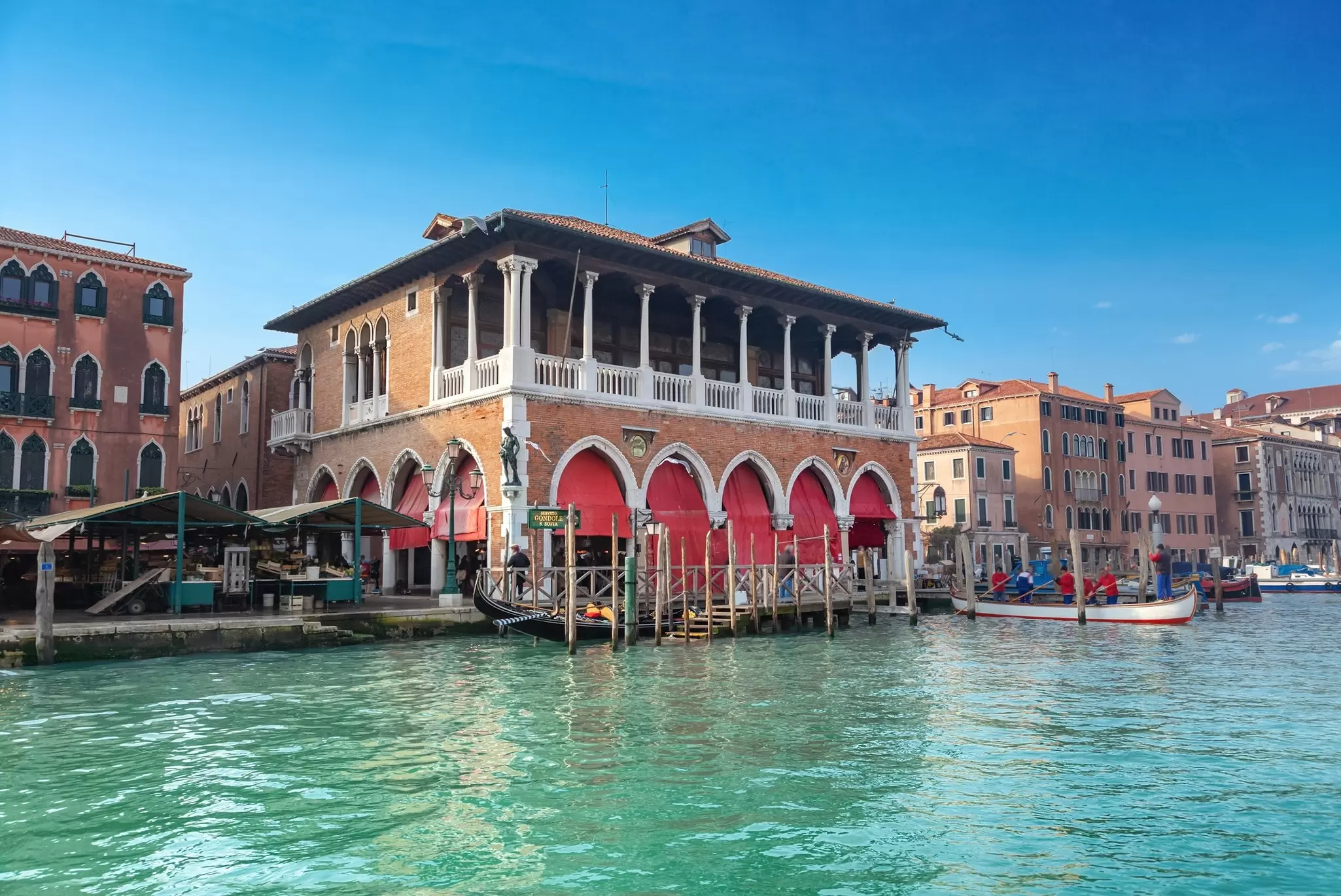 View of the Rialto Market housing the Pescaria from the Grand Canal in Venice, Italy.