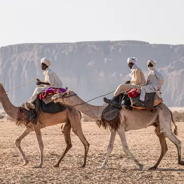Nomad with camels in the Sahara desert, Chad, November 17, 2017; Shutterstock ID 1565647990; your: Sloane Tucker; gl: 65050; netsuite: Online Editorial; full: Destination Page