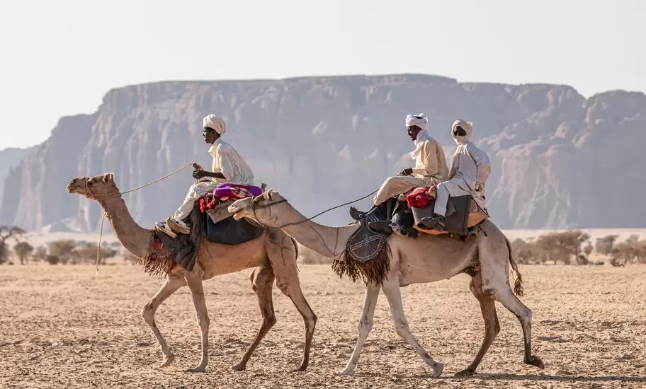 Nomad with camels in the Sahara desert, Chad, November 17, 2017; Shutterstock ID 1565647990; your: Sloane Tucker; gl: 65050; netsuite: Online Editorial; full: Destination Page