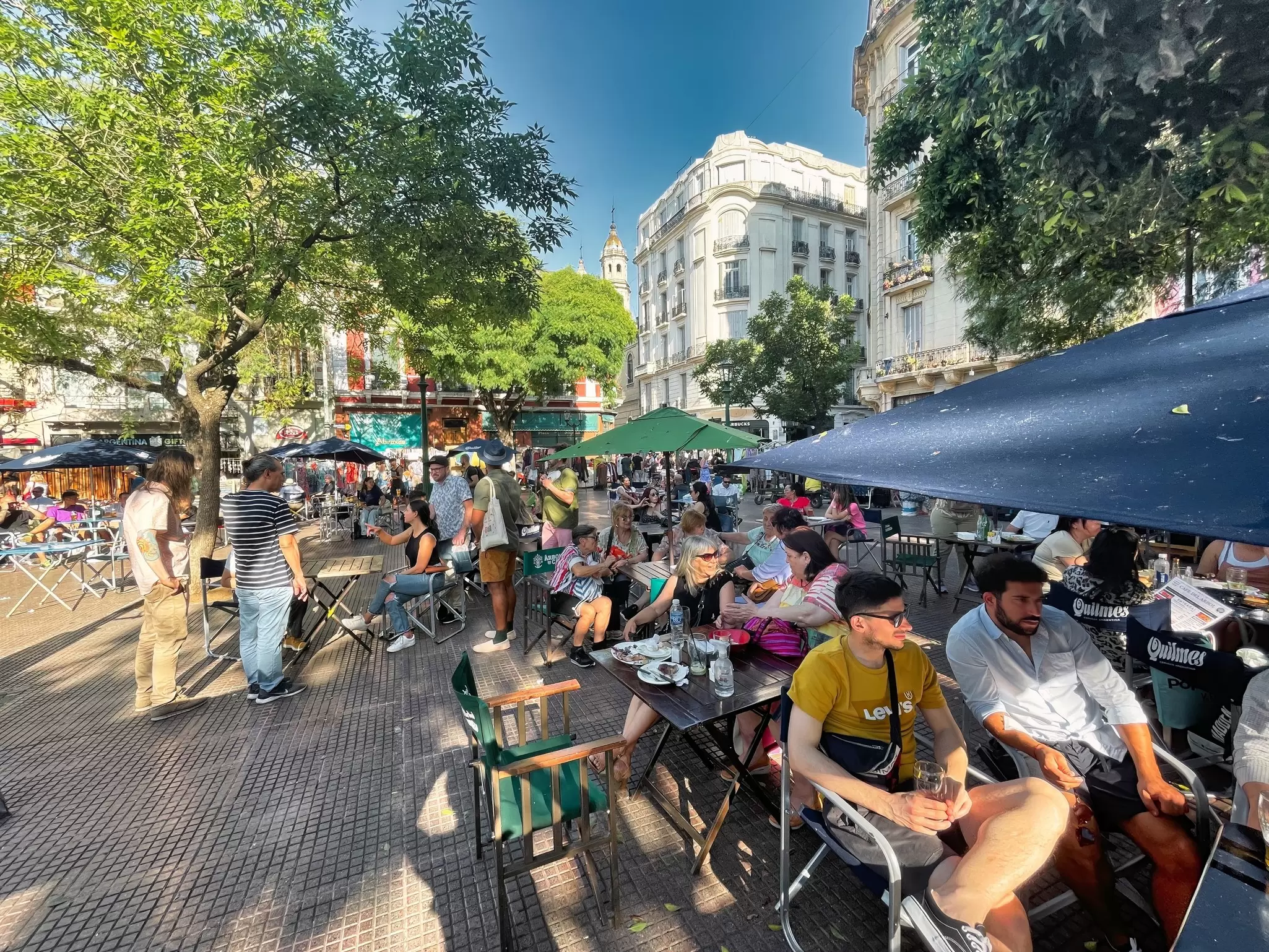 People sit at tables at the popular Plaza Dorrego in Buenos Aires, Argentina.