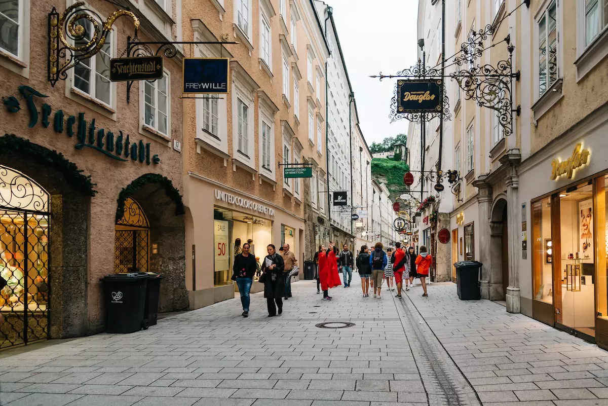 People strolling along the scenic cityscape of Salzburg
