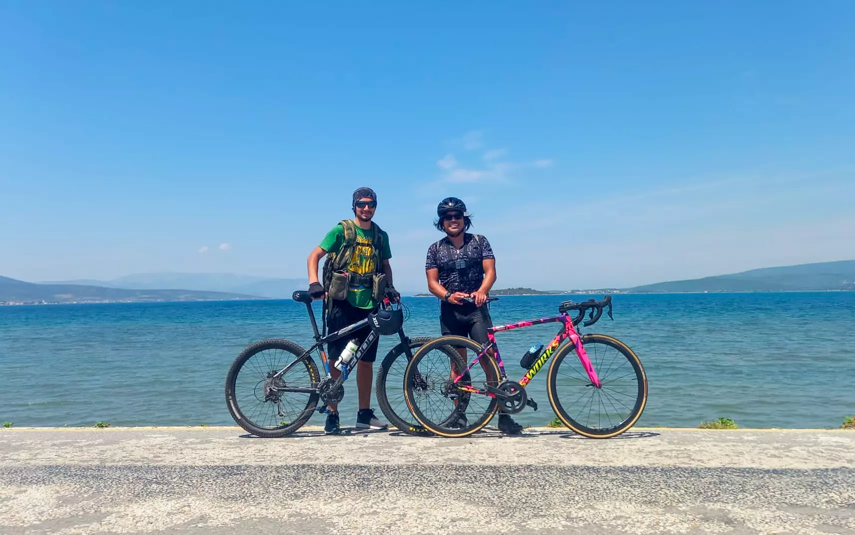 Erik Trinidad and his guide, Yiğit, stop for a photo on the coast © Erik Trinidad/Lonely Planet