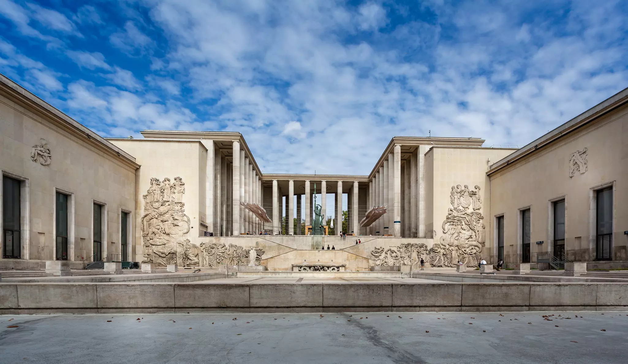 The grand exterior of the Palais de Tokyo in Paris on Avenue Président Wilson, with blue sky above