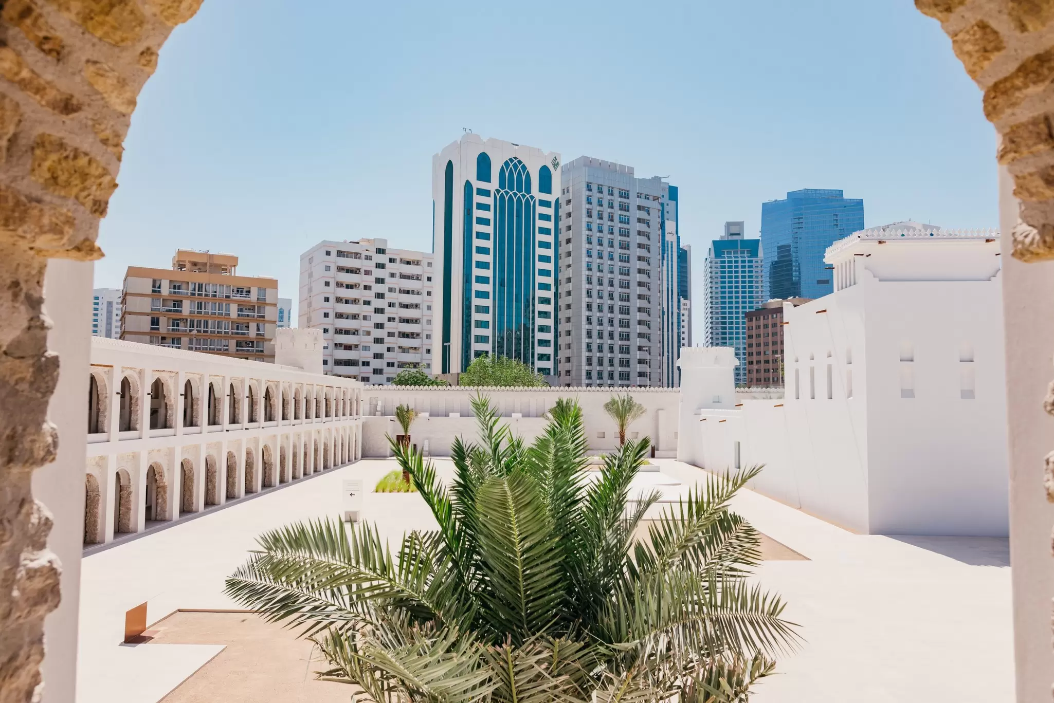 View of plants in a courtyard at the Al Hosn site on a sunny day in Abu Dhabi.