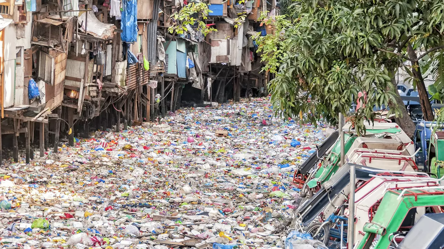Shanties on stilts standing on a polluted river in the Philippines (stock photo) Getty Images