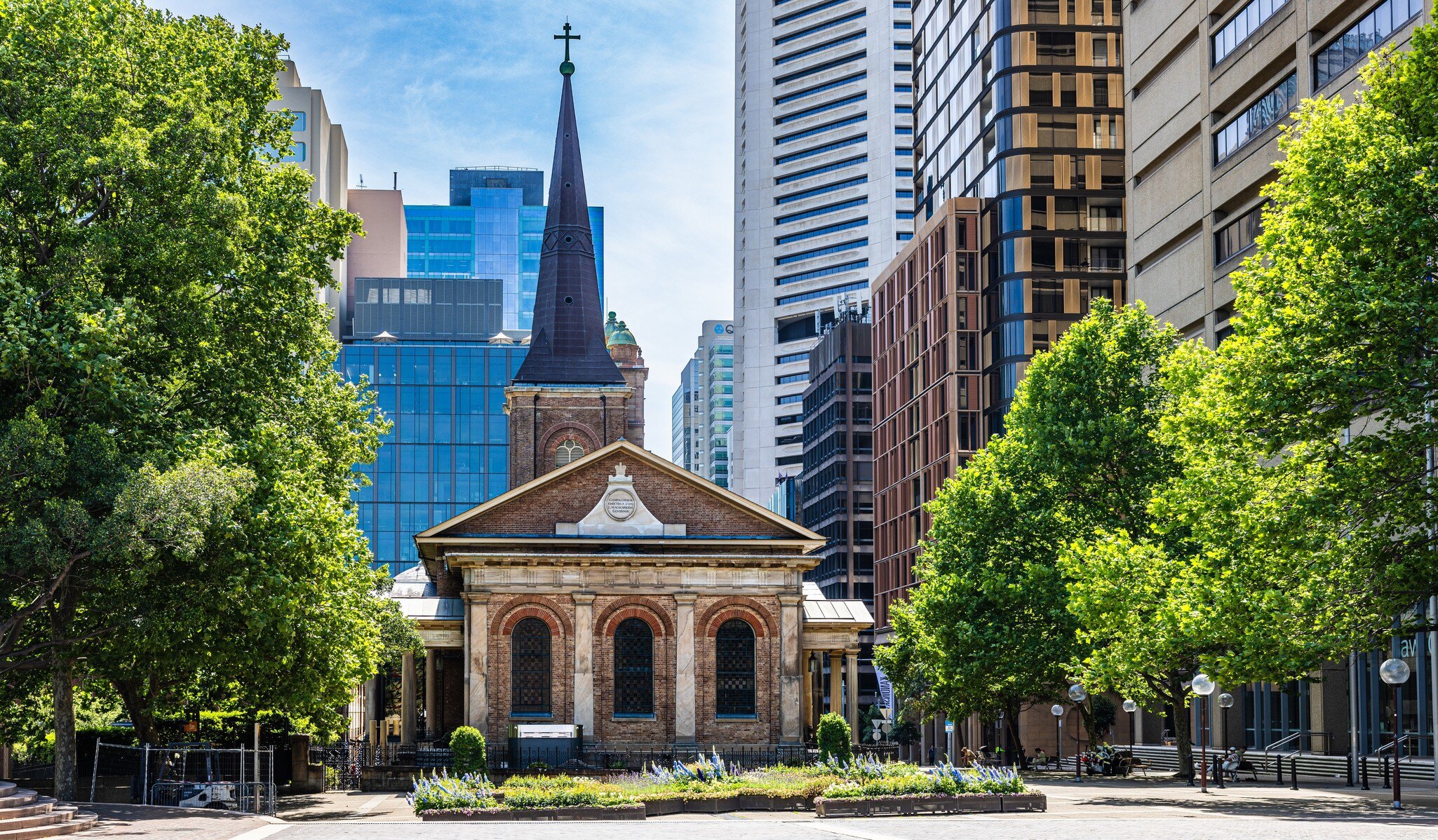 Facade of St James Church in Queens Square and Law Courts buildings. Sydney, Australia.
