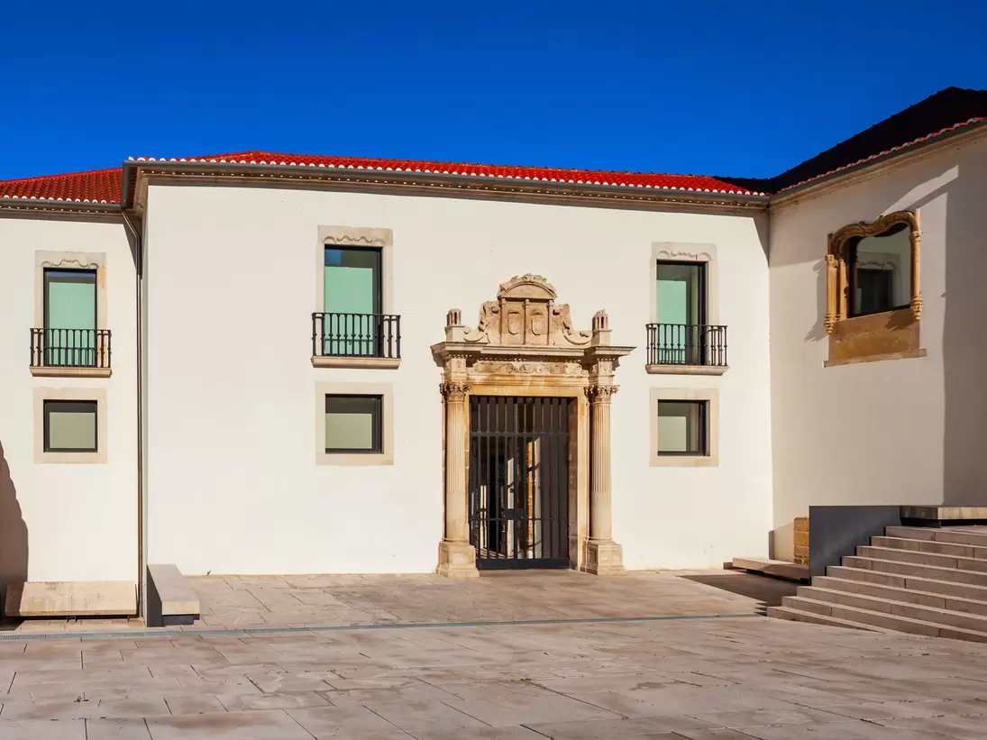 View of the entrance to the Museu Nacional de Machado de Castro on a sunny day in Coimbra, Portugal.