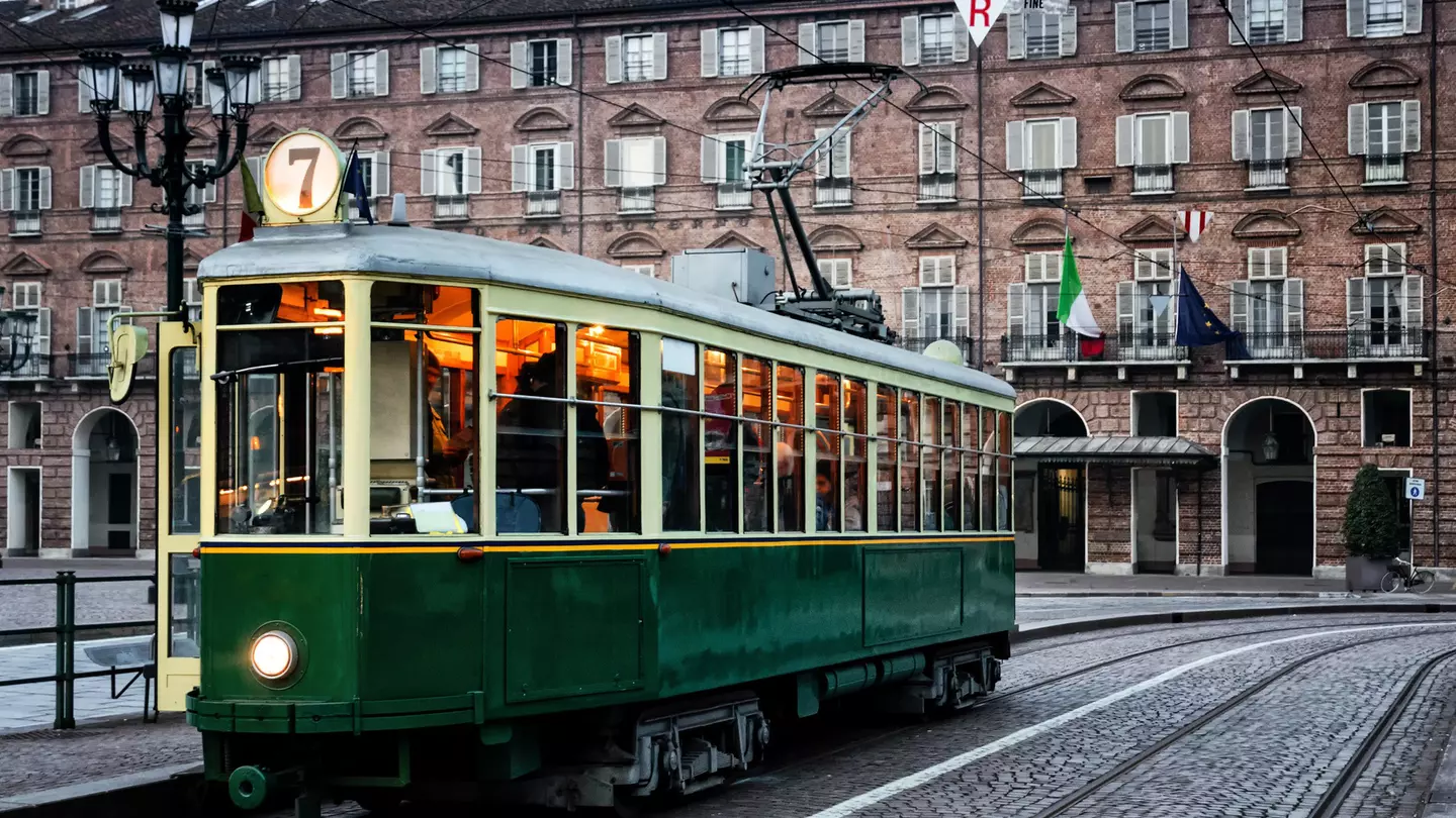 Turin's historic tram outside a brick building