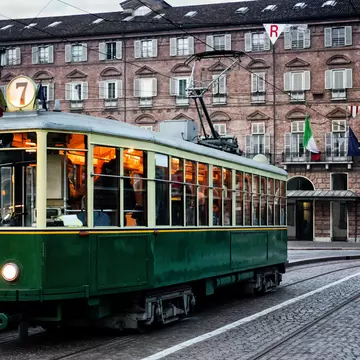 Turin's historic tram outside a brick building