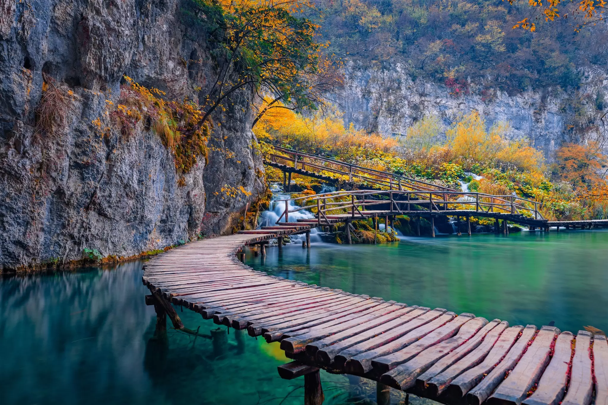 Superb evening view of pure water waterfall in Plitvice National Park. Spectacular autumn scene in Croatia, Europe. Beauty of nature concept background.
