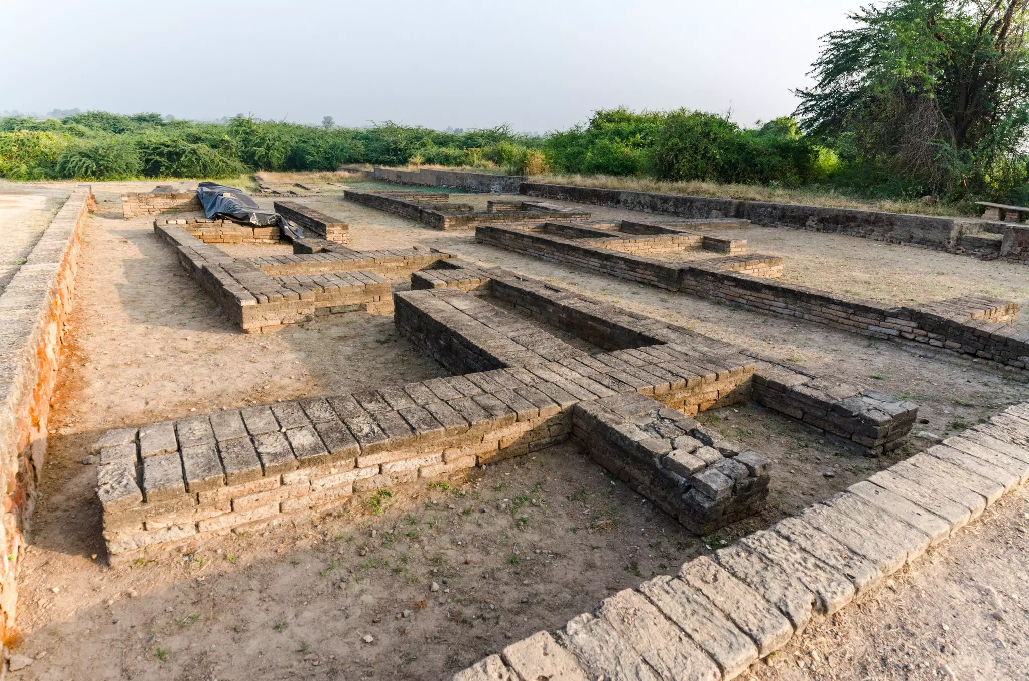 Brick walls at an archaeological site marking the footprint of an ancient civilization