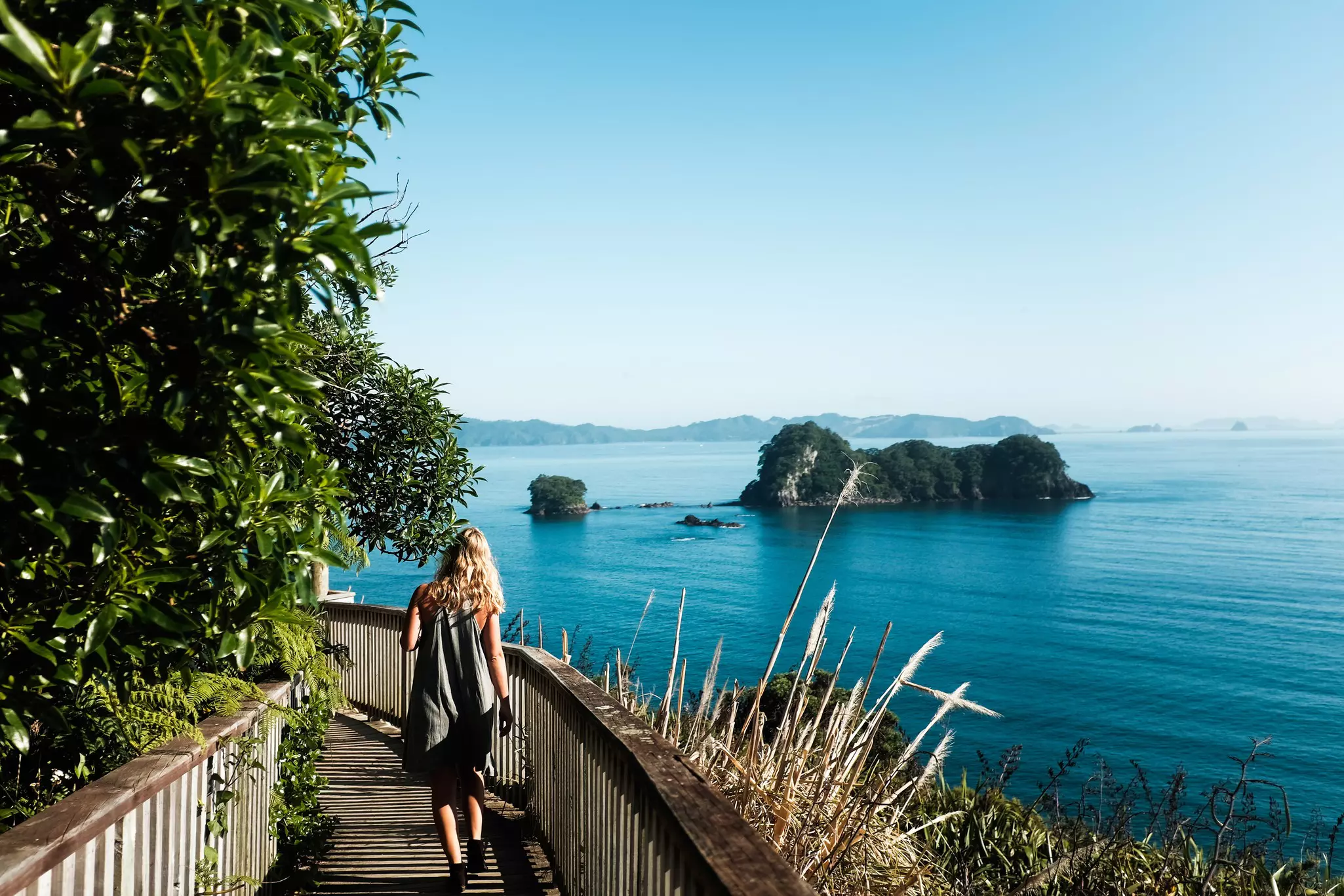 Girl woman on beach cathedral cove coromandel