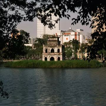View of the Turtle Tower in Hoan Kiem Lake in Hanoi, Vietnam.
