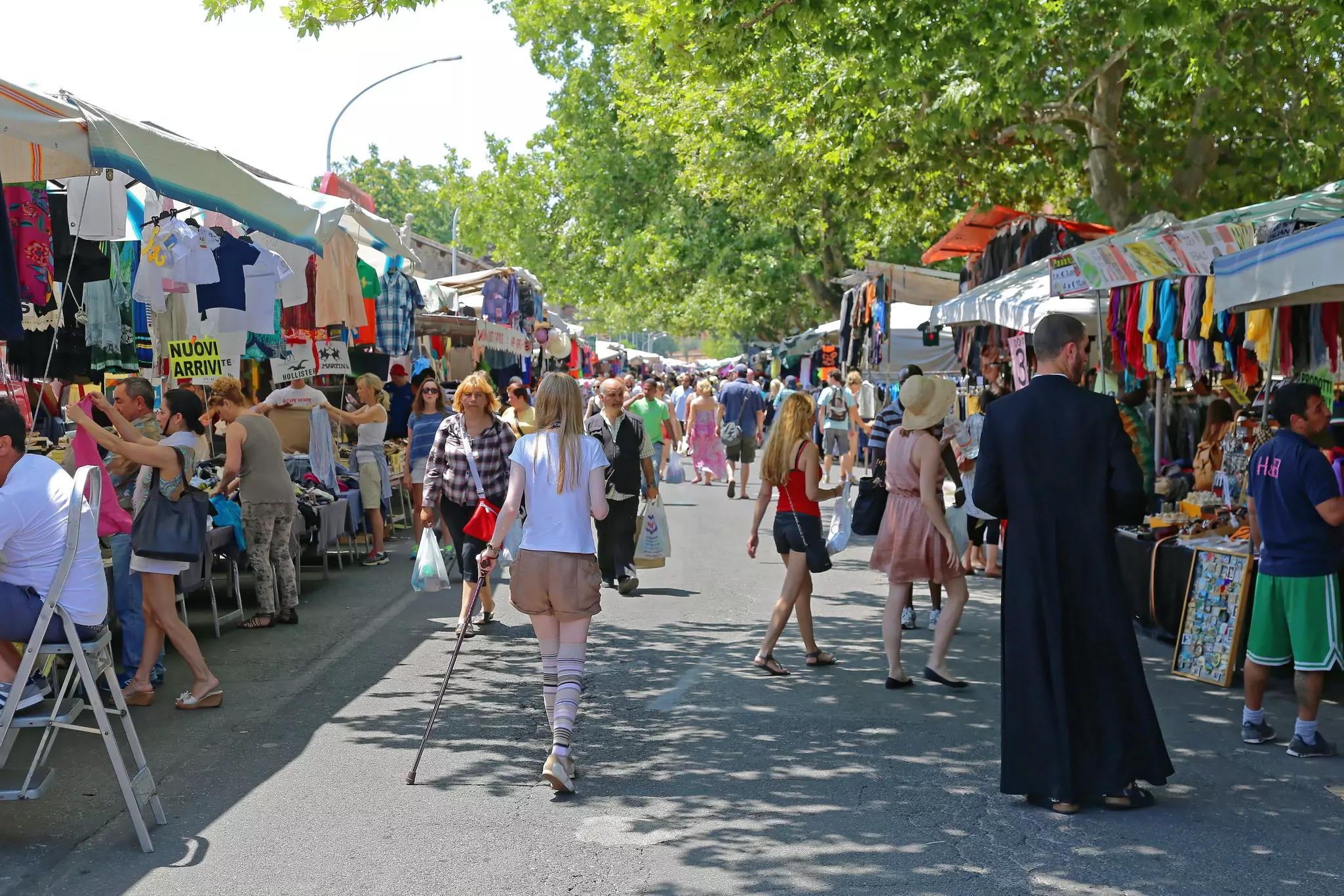 People browsing the stalls at the Porta Portese Sunday Flea Market in Rome