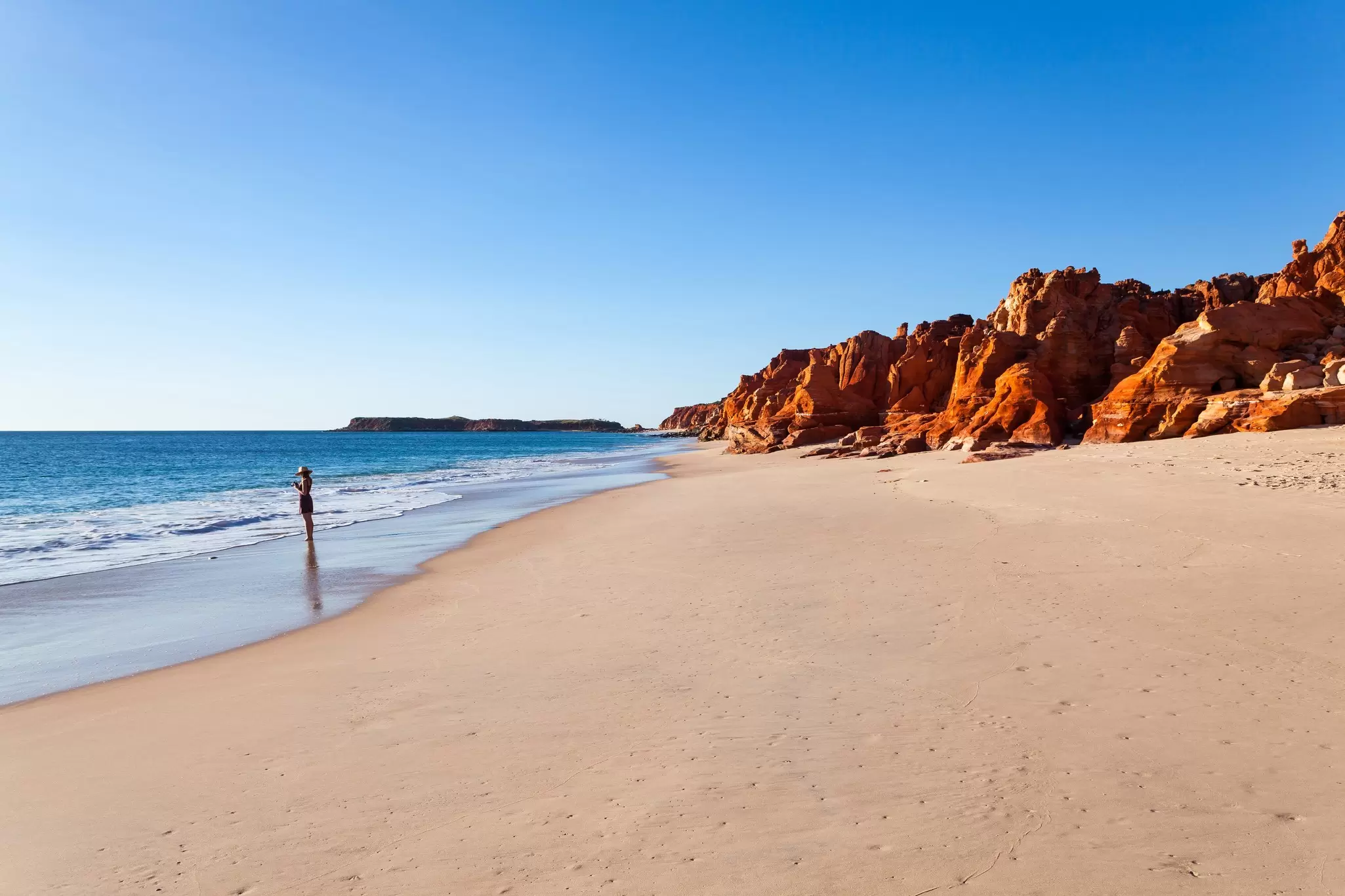 A girl stands at Cape Leveque. Cape Leveque is the northernmost tip of the Dampier Peninsula in the Kimberley region of Western Australia. Cape Leveque is 240 kilometres north of Broome.