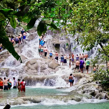 January 31, 2019: Tourists climbing the rocky terrace of Dunn’s River Falls.