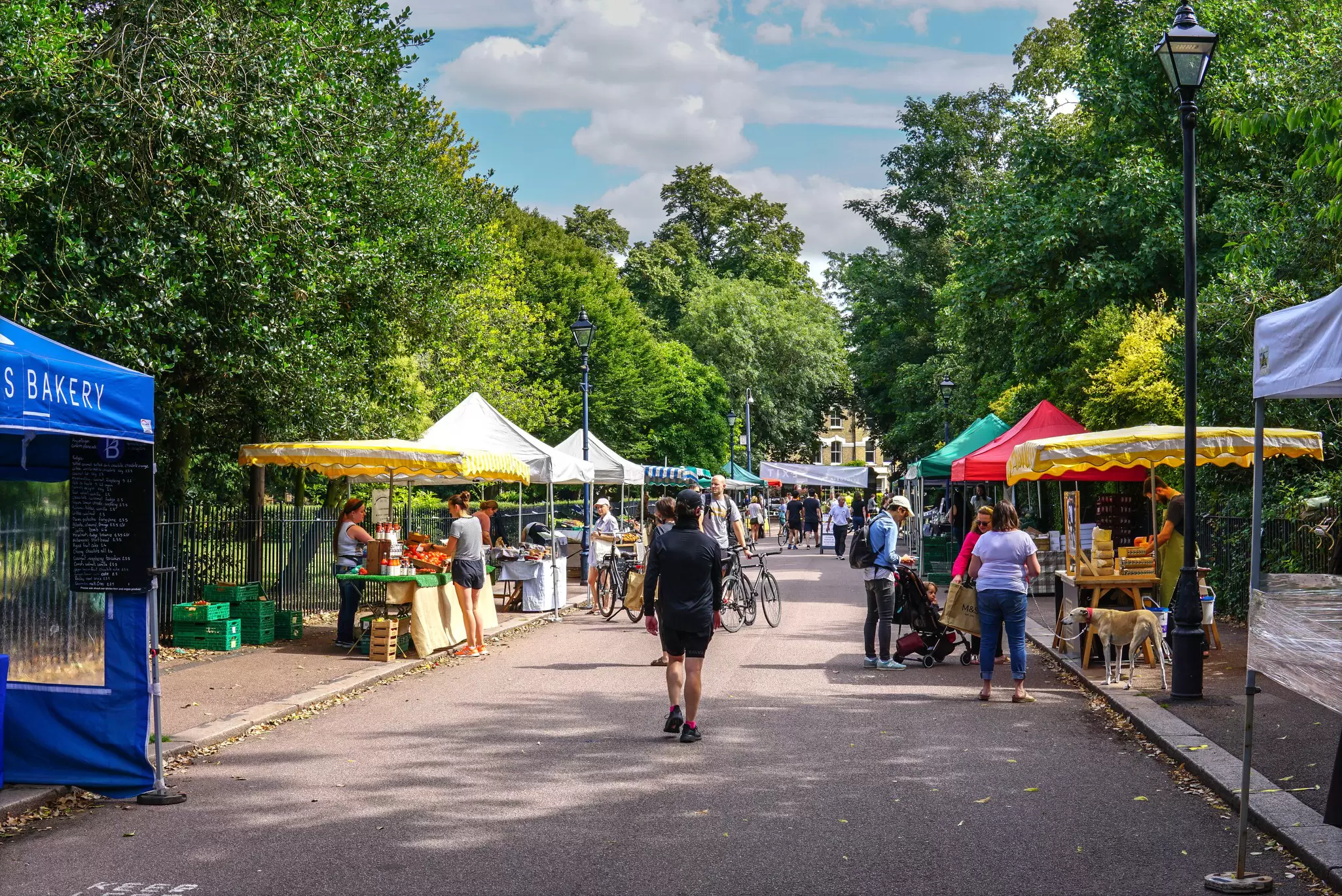 Visitors at Victoria Park's Sunday Market on a sunny weekend in London, UK.
