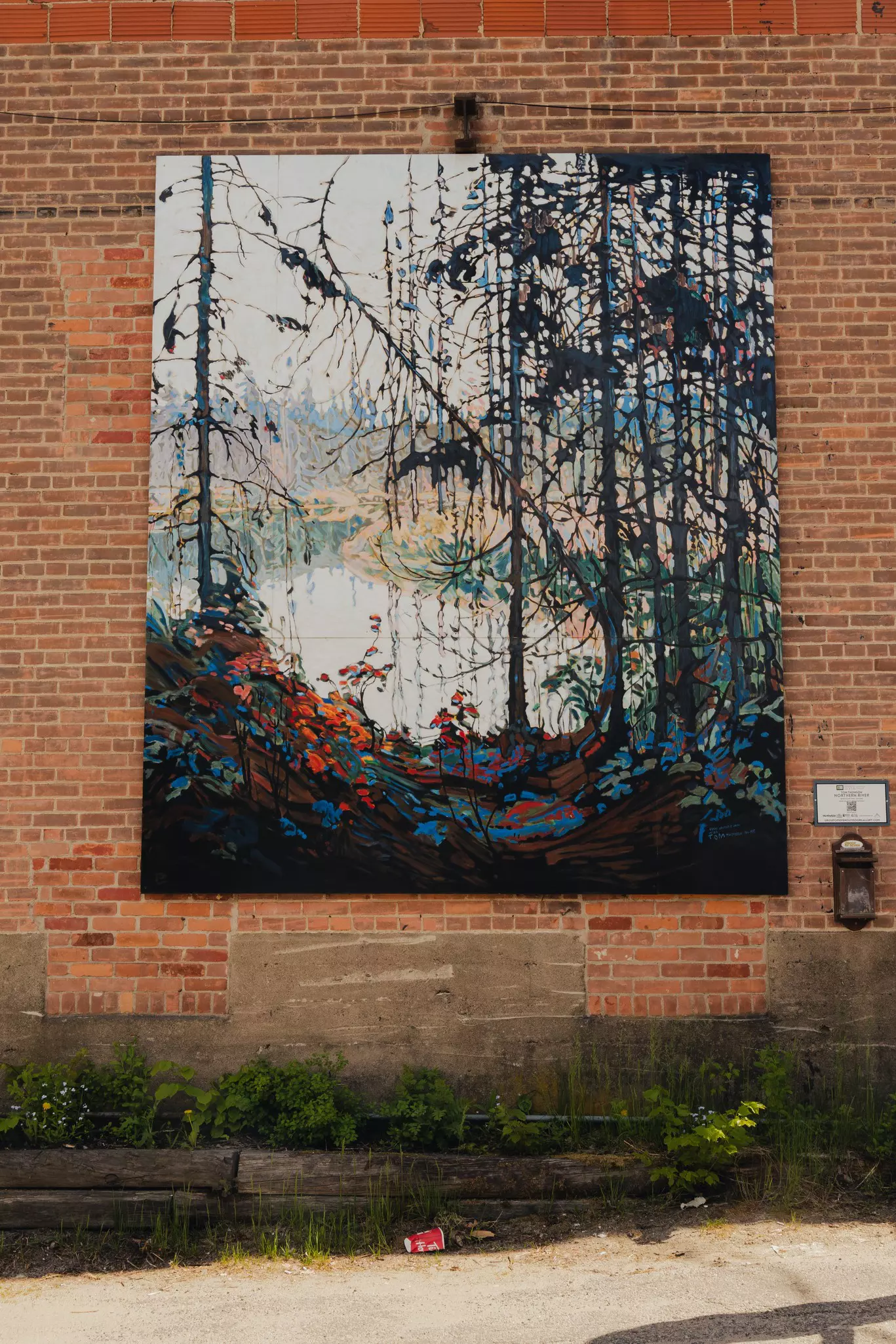 A mural on a brick wall.