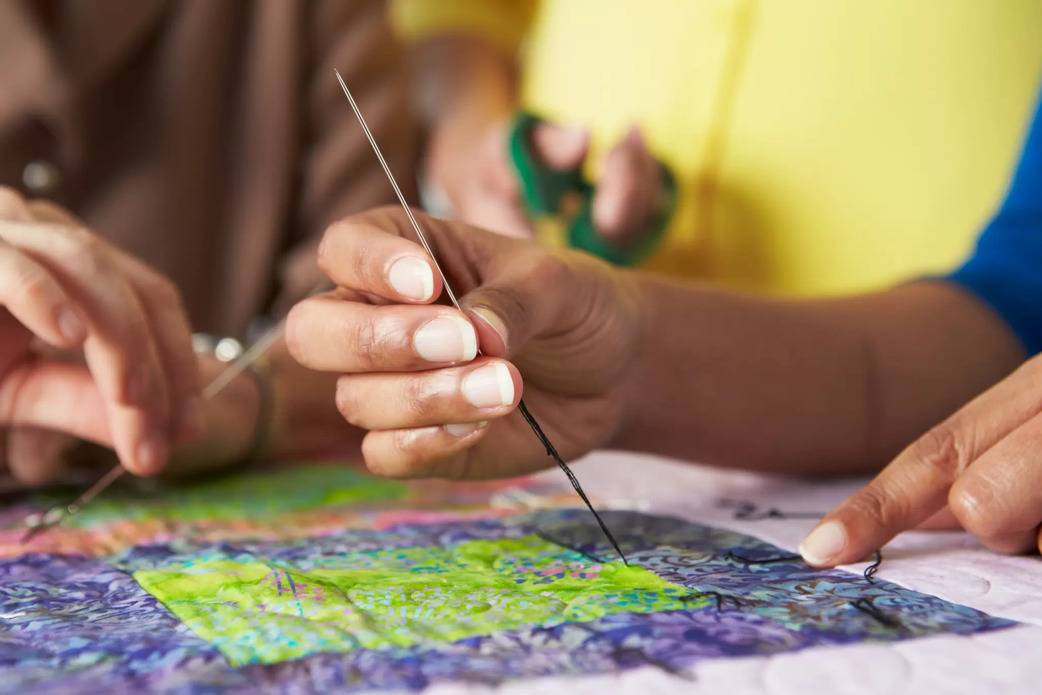 Quilting is often a collaborative effort in the USA. monkeybusinessimages / Getty Images