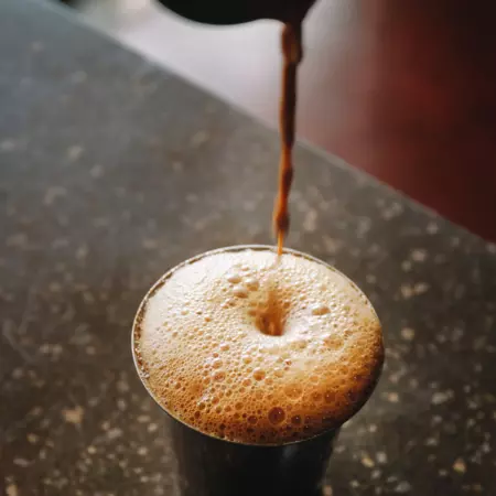 frothy filter kaapi poured into a tumbler
