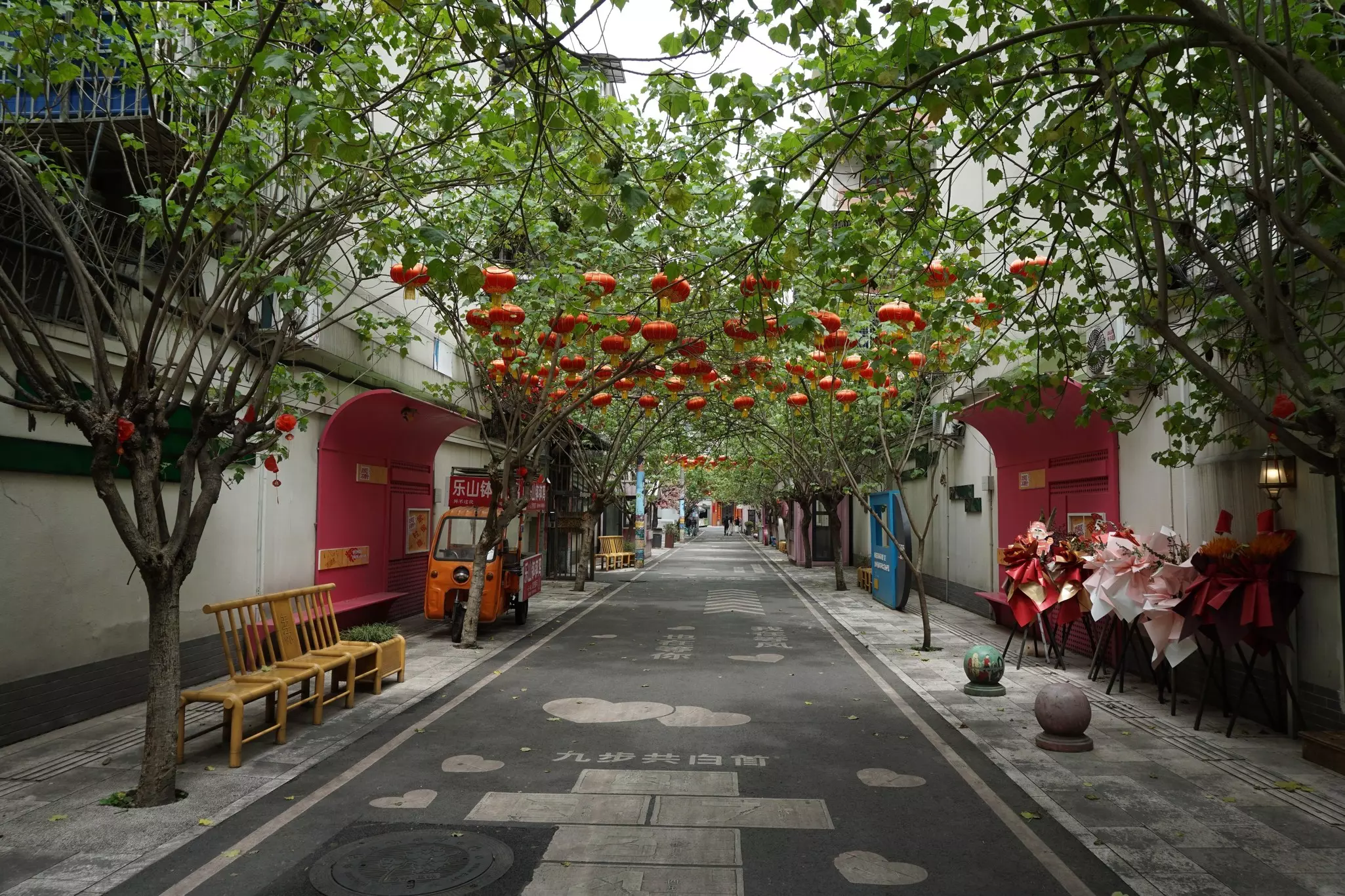 Lanterns on a leafy lane in Yulin, Chengdu, Sichuan, China.