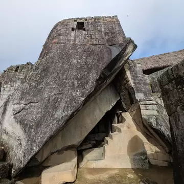 The triangular opening of the Royal Tomb located below the Temple of the Sun in Machu Picchu, Peru.