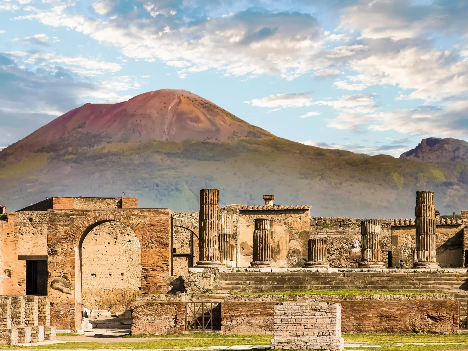 Mt Vesuvius, near Naples, looms over the ruins of the ancient city of Pompeii. dbvirago/Getty Images