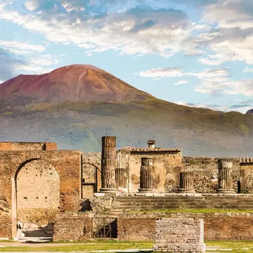 Mt Vesuvius, near Naples, looms over the ruins of the ancient city of Pompeii. dbvirago/Getty Images