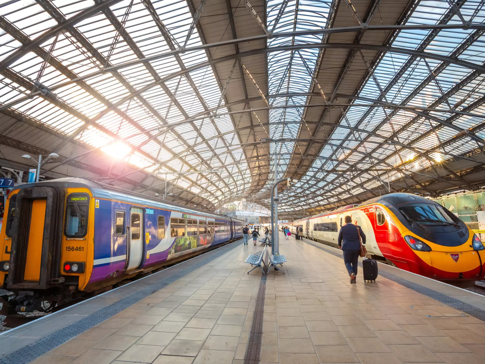 Two trains wait on platforms at Liverpool Lime Street terminus in Liverpool